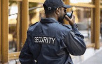 Security officer using a radio